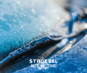 Ice on windshield wiper in winter.